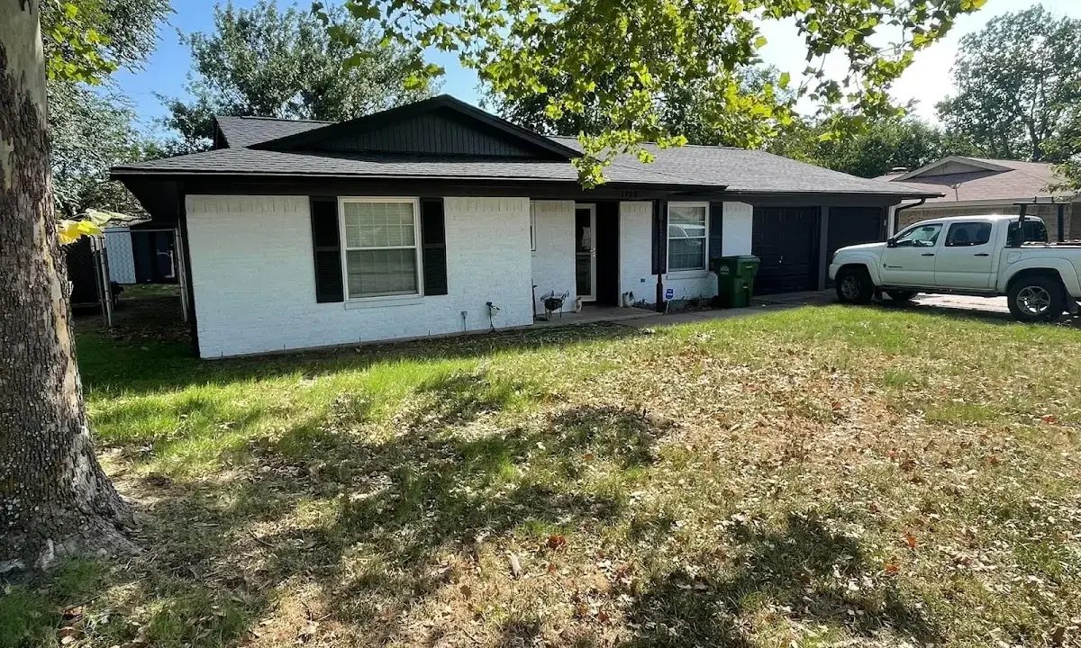 Professional roofing crew working on a residential roof in Peoria